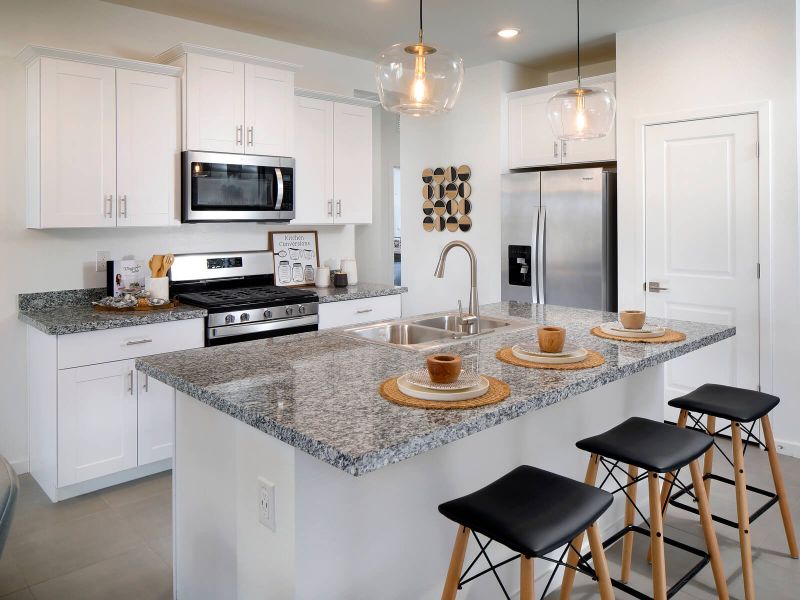 Enjoy grey countertops with complimentary white cabinets.