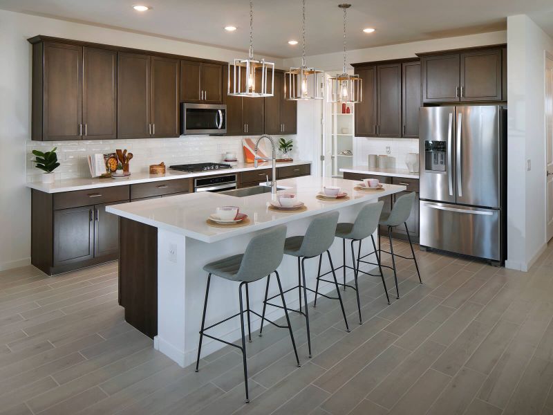 The large kitchen island makes it easy to host guests.