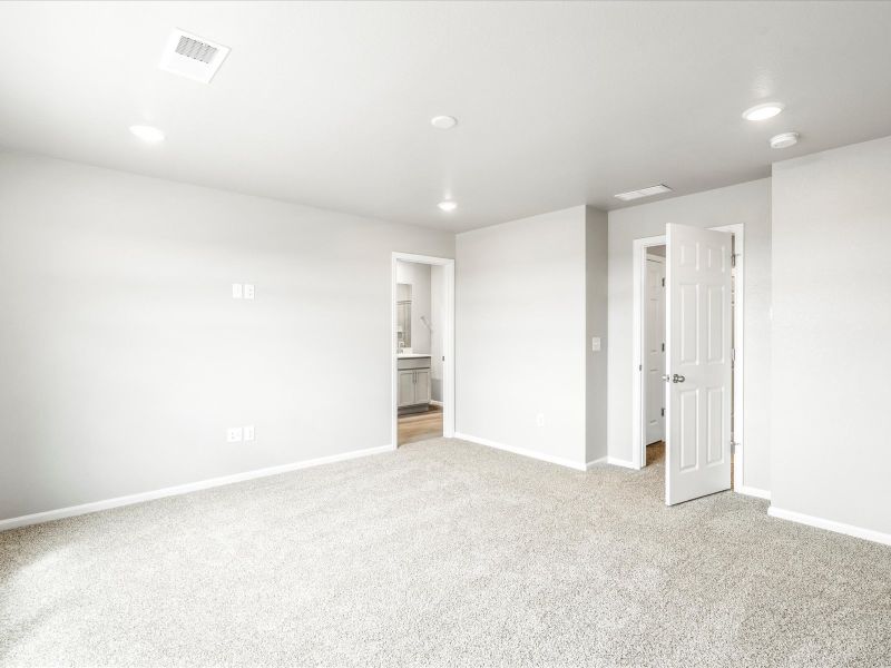 Primary bedroom in the Orchard floorplan at a Meritage Homes community in Aurora, CO.