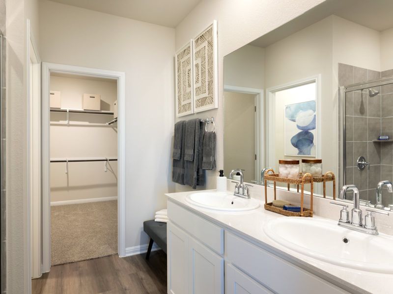 Live luxuriously with double sinks, a walk-in shower, and walk-in closet in the primary bathroom.