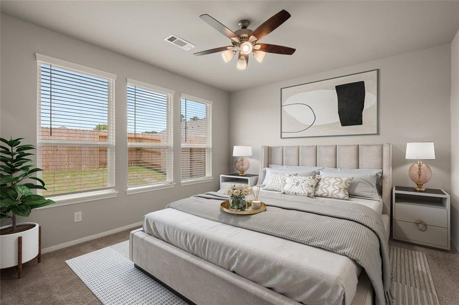 The primary bedroom is generously sized, creating a tranquil and spacious retreat that offers ample room for relaxation. Featuring plush carpet, high ceilings, fresh paint, and large windows that lets in natural lighting throughout the day.