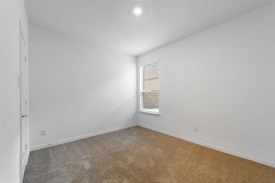 Unfurnished room with carpet