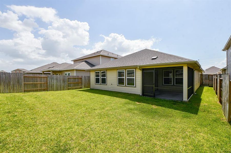 The house has a covered patio area, great for outdoor activities and relaxation.