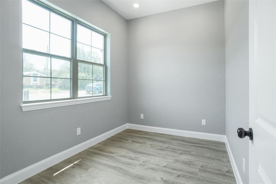 Spare room with light hardwood / wood-style flooring