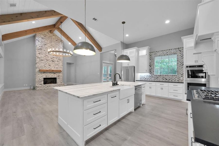 vaulted ceiling with solid beams and shiplap