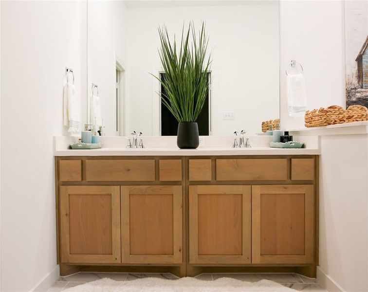 Bathroom featuring dual vanity and tile patterned floors