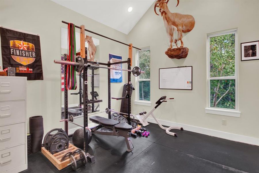 This room is a dedicated home gym for the current owners.  However, it could also serve as a perfect study for the one who works from home.   It has ample natural light from two windows and features a neutral color palette, suitable for personalized decor.