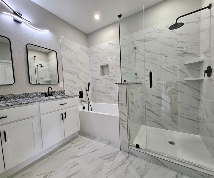 Master Bathroom featuring dual vanity and independent shower and bath