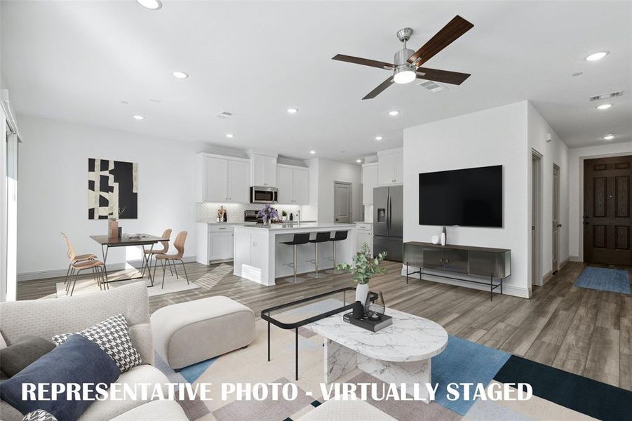 The entire family will enjoy gathering in this spacious, open concept home!  REPRESENTATIVE PHOTO - VIRTUALLY STAGED