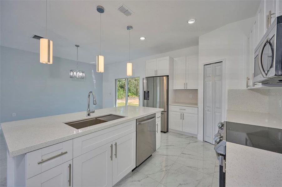 All the cabinetry is soft close.  The quartz counter tops are gorgeous!  Closet pantry is a nice size.