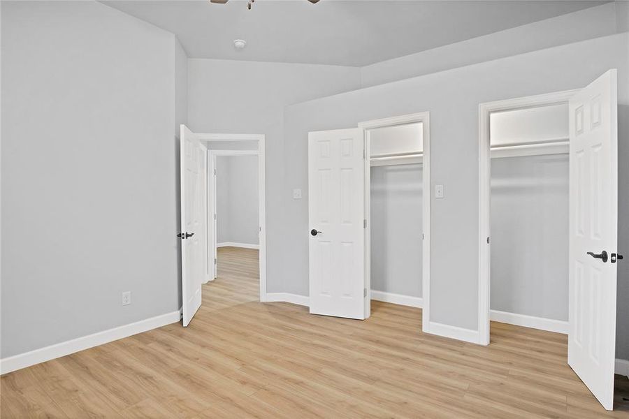 Spare bedroom with ample closet space, ceiling fan and high ceilings!