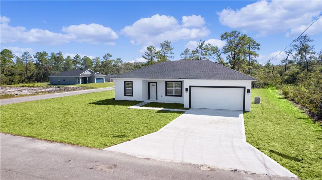 The front of the property from the paved road