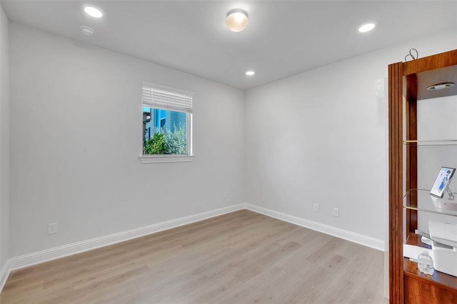 Unfurnished room featuring light hardwood / wood-style flooring