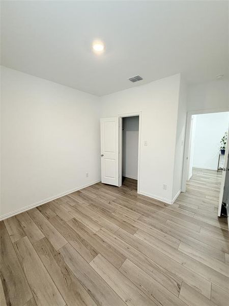 Unfurnished bedroom featuring light hardwood / wood-style floors