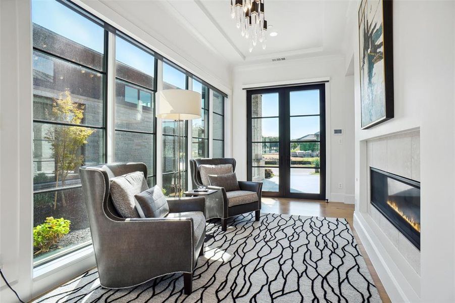 Grand Foyer with Sitting Area & Dual Sided Fireplace...