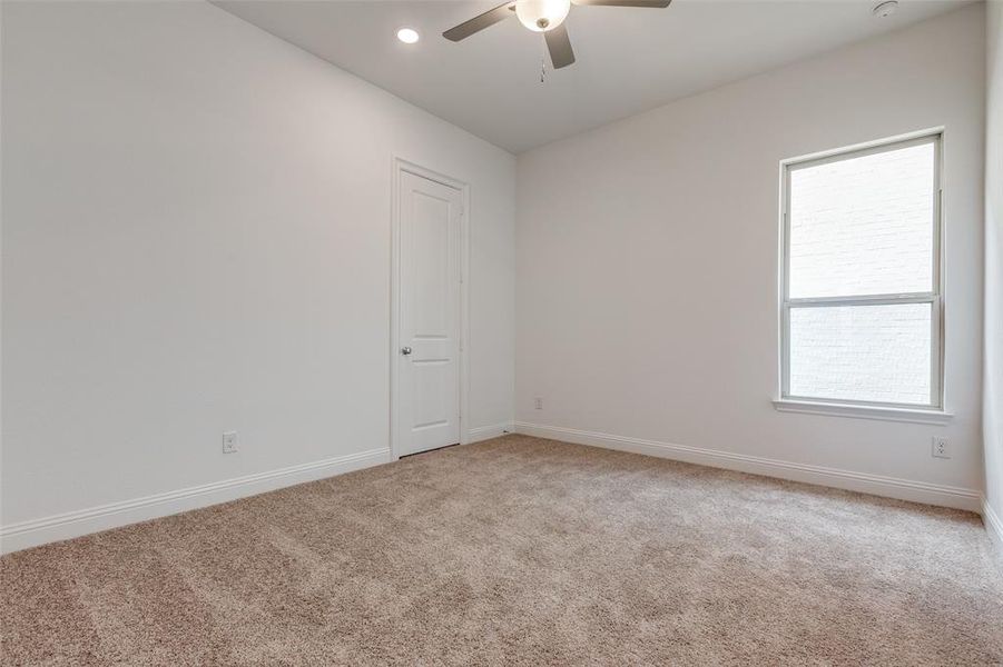 Room featuring ceiling fan and carpet flooring