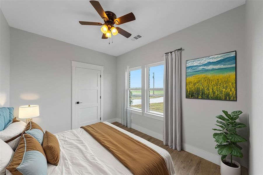 Virtual Staging Bedroom with ceiling fan and hardwood / wood-style flooring