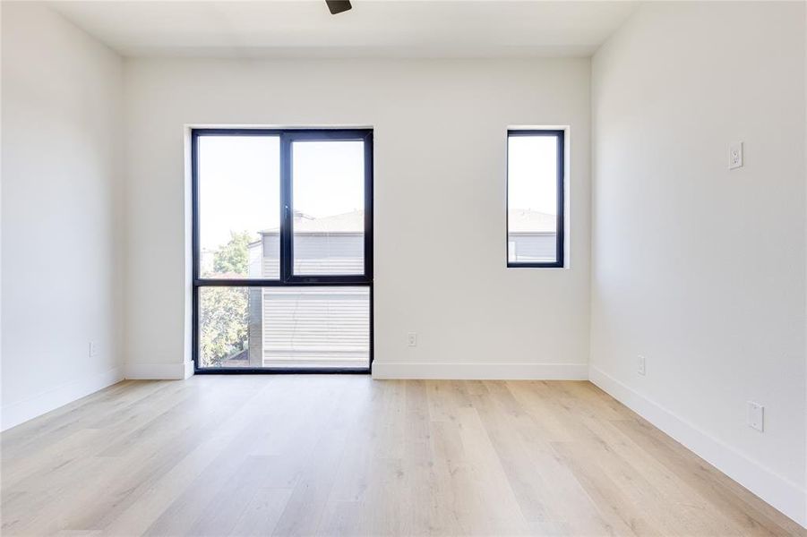 Unfurnished room with light hardwood / wood-style flooring