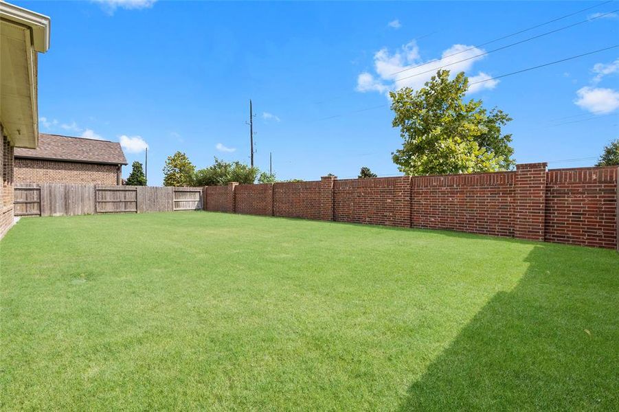 With no neighbors behind, this spacious yard offers privacy and openness.