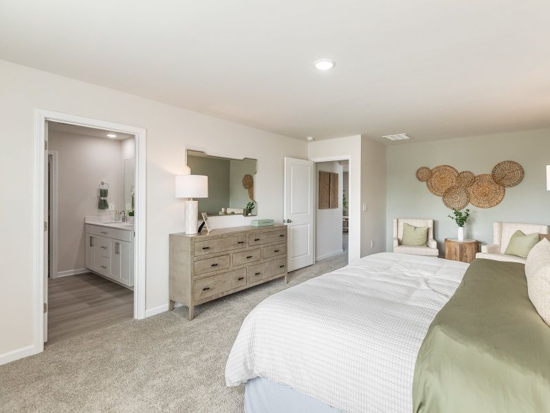 Primary bedroom in the Chatham floorplan at a Meritage Homes community in Angier, NC.