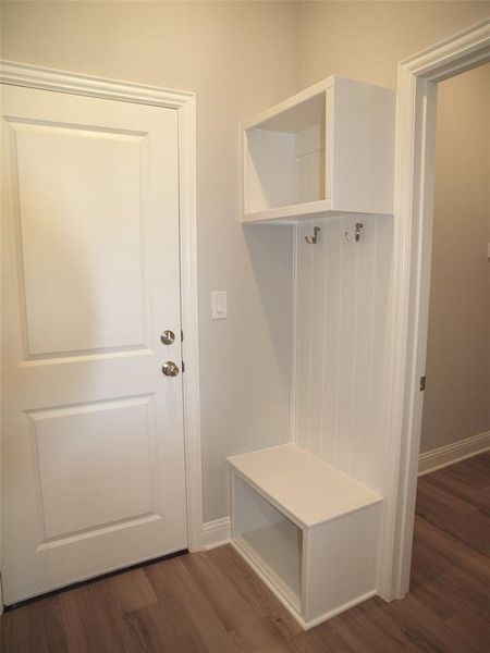 Mudroom with dark hardwood / wood-style flooring