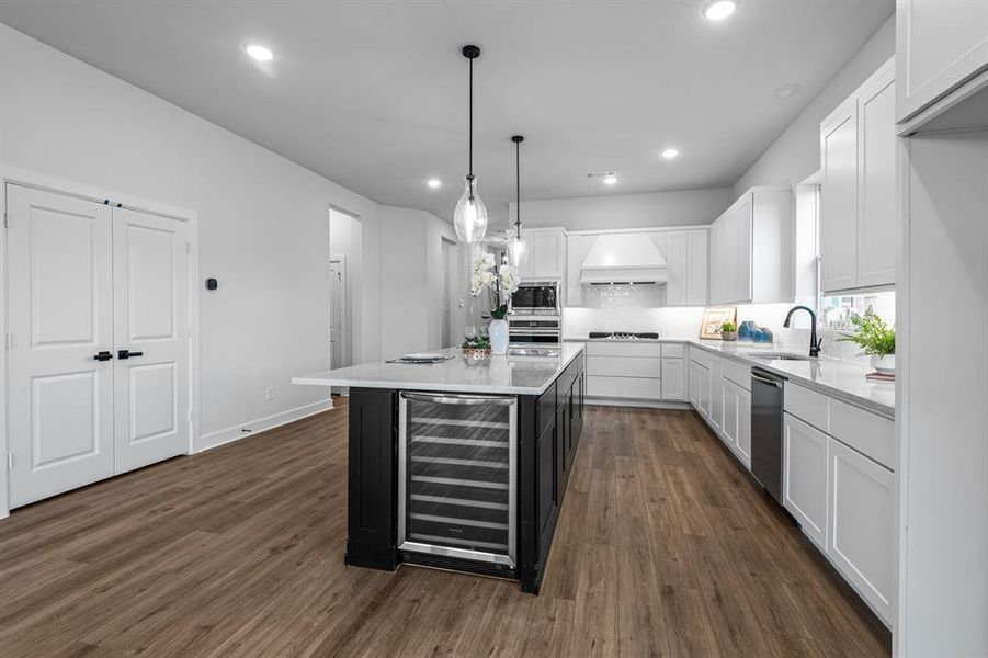 EXAMPLE PHOTO: Wine Fridge compliments this kitchen! Room for 6 bar stools, updraft vent hood! Light and bright!  Big pantry too!