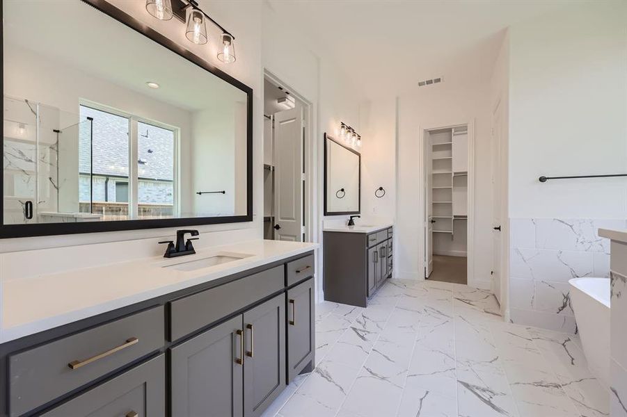 Bathroom with vanity, independent shower and bath, and tile patterned flooring