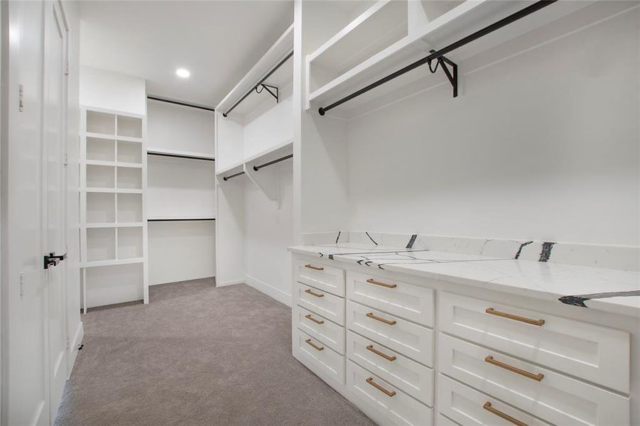 Walk in closet featuring carpet