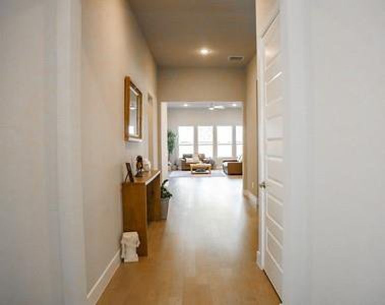 Hallway featuring light wood-type flooring