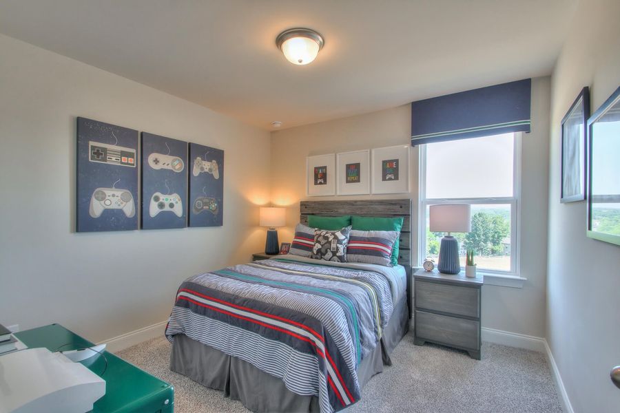 Secondary bedrooms give kids their own space to relax. Photography from  Skyridge in Nashville.