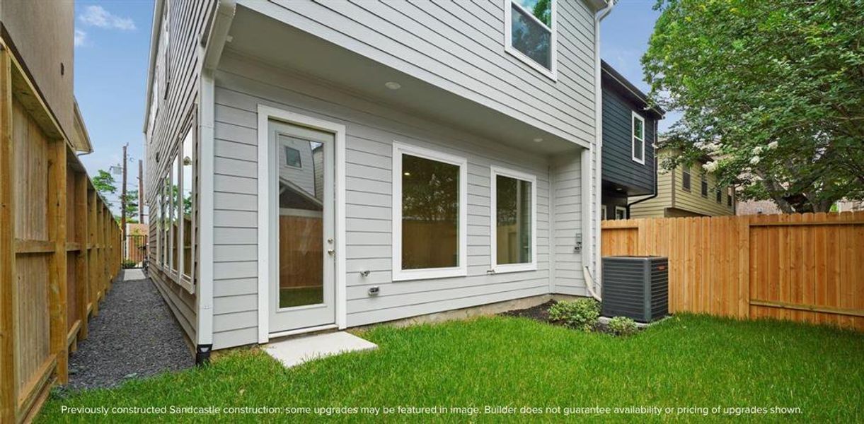 Backyard View: Experience elegance from the welcoming perspective of a lush, grassy backyard. Capture the essence of this exquisite home and see every detail for yourself. Contact us to schedule your viewing appointment and discover your dream home today.