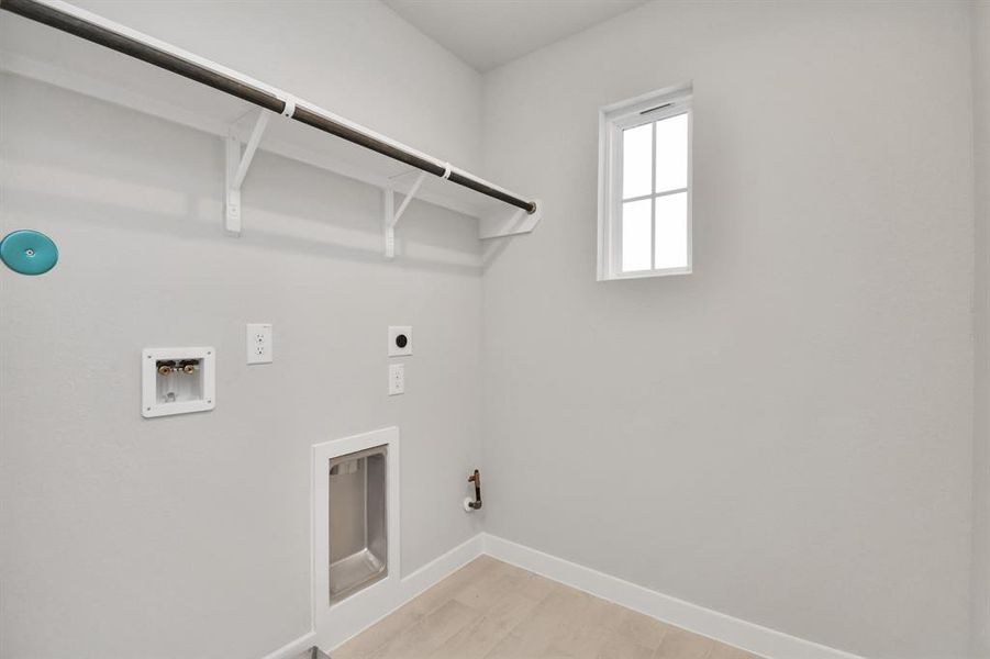 Located on 2nd floor, a stylish laundry room where practicality meets a contemporary aesthetic. The dark finishes lend a sophisticated touch, creating a space that is both functional and visually appealing. Both electric and gas connections available.