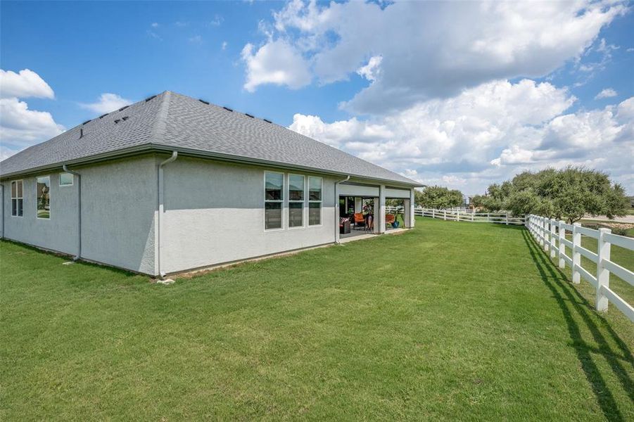 View of backyard with grass area