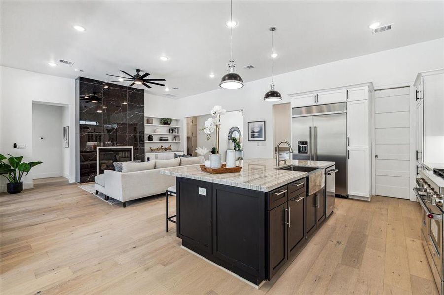 On the right you will see sleek pocket door leading to a walk-in pantry with shelving for all your storage needs.