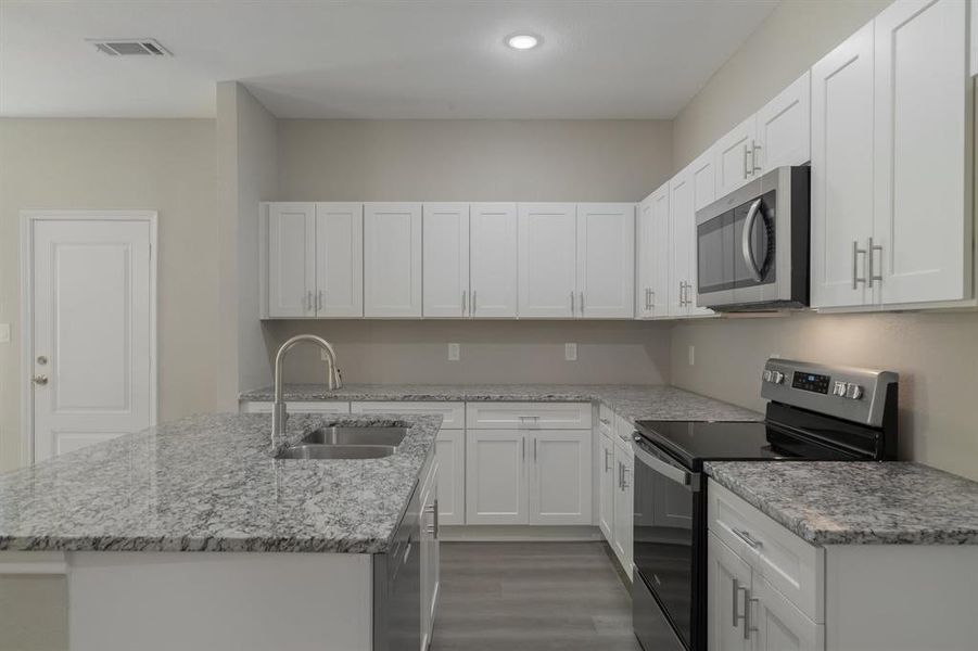 Kitchen with stainless steel appliances