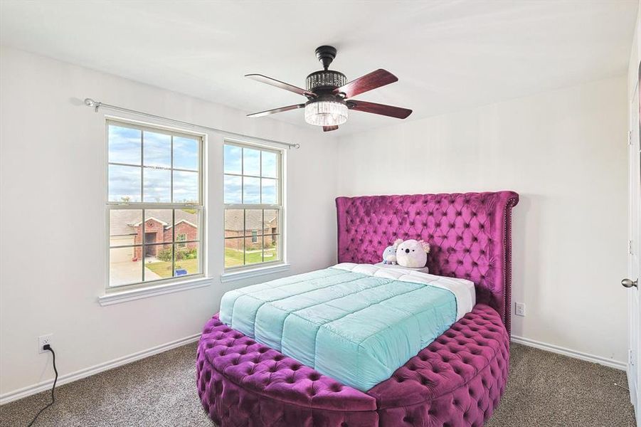 Bedroom with carpet flooring and ceiling fan