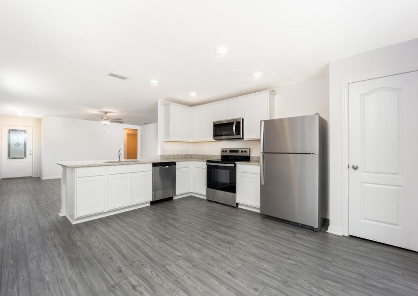 A full suite of stainless steel appliances will the kitchen