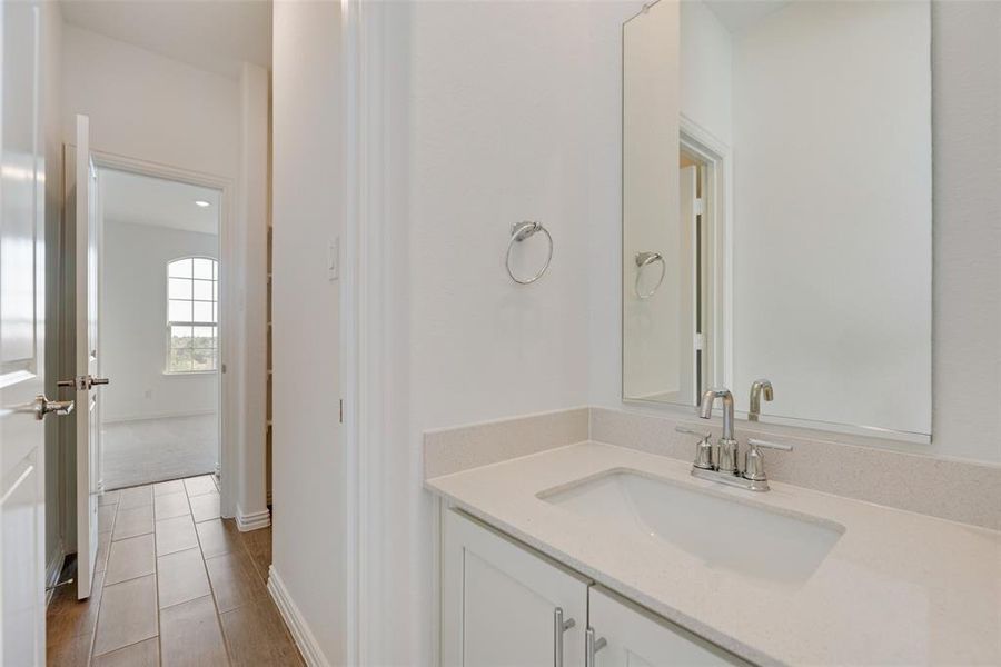 Bathroom featuring vanity and tile patterned floors