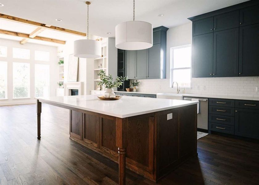 Kitchen with dishwasher, a kitchen island, dark hardwood / wood-style floors, and a healthy amount of sunlight