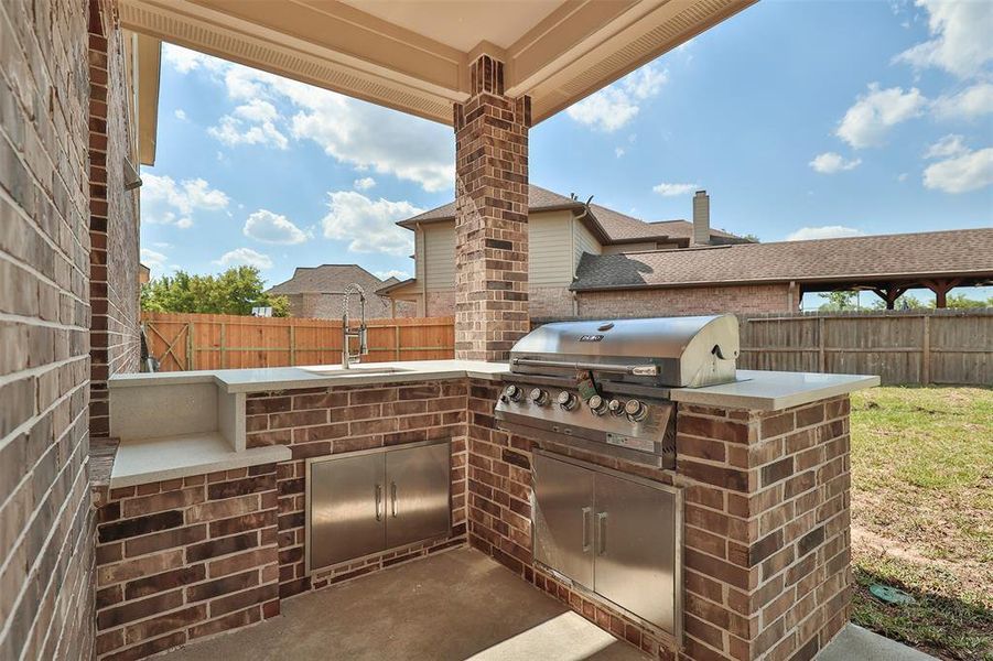 The Outdoor Kitchen will have you ready for summer cookouts, with a 5-burner propane grill built right in!