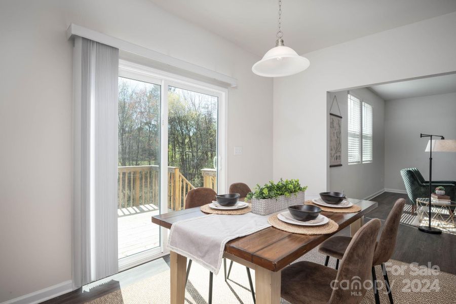 Dining area open to kitchen and living room and access to rear deck