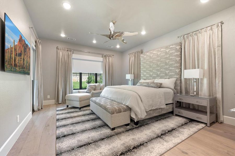 Bedroom featuring ceiling fan and light hardwood / wood-style floors