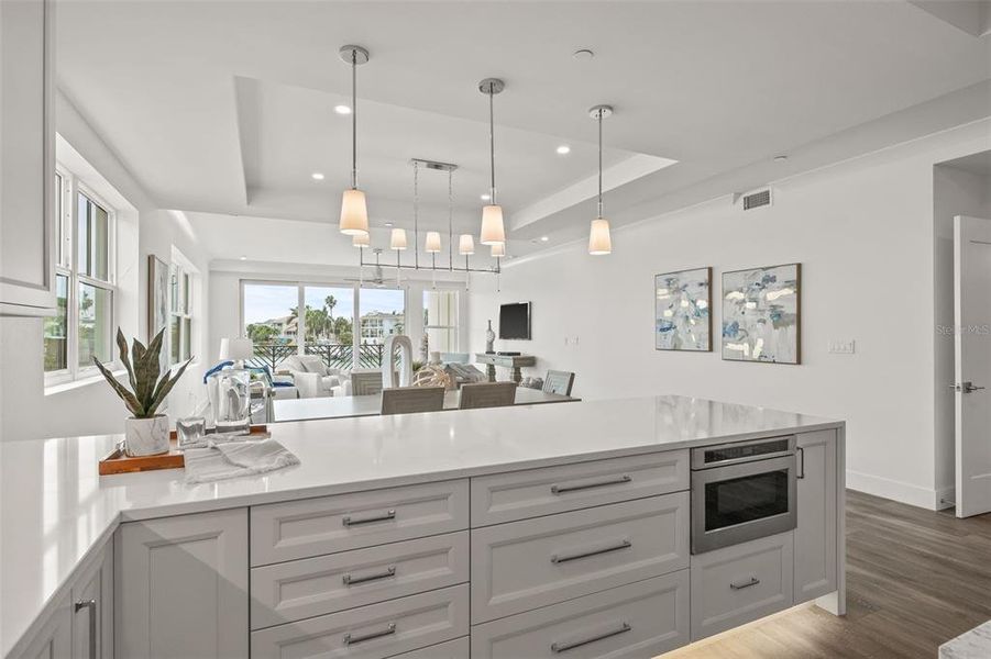 Overlook the water views while you entertain guests from the kitchen with the open-concept living space.