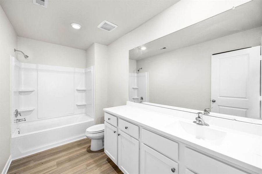 The counter space and cabinet storage in the secondary bathroom are a wonderful feature of the Osage floorplan.