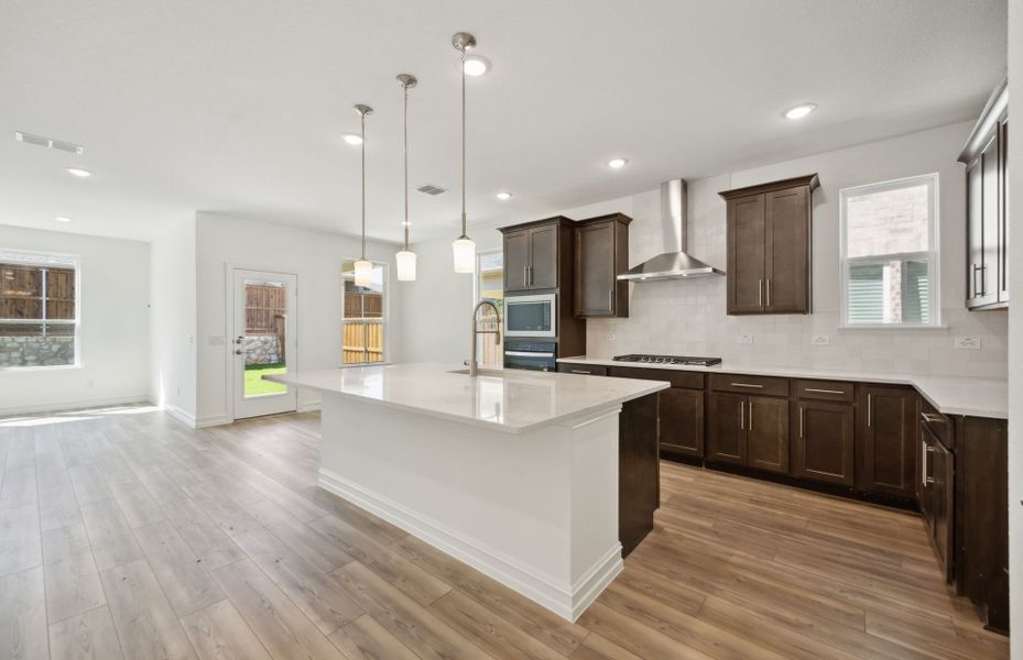 Bright kitchen with oversized island *real home pictured