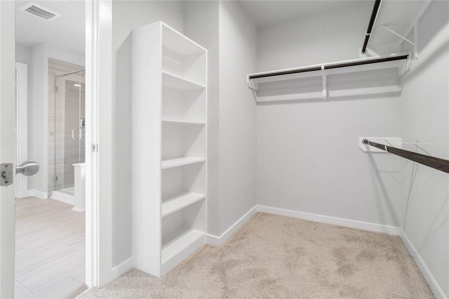 Look at this immaculate closet! With high shelving, multiple rows to hang clothing, you are sure to have enough room for all your belongings!