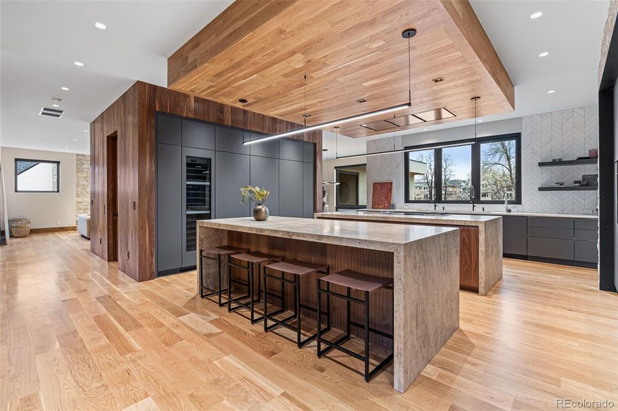 Entertainers dream kitchen designed to elevate your hosting experience. Leathered quartz countertops, Eclipse by Shiloh Cabinetry and cabinet-faced top of the line Miele appliances.