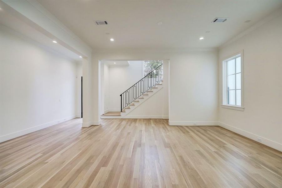 The grand dining room is just off the living area and features recessed lighting, large windows, and gleaming hardwood floors! Very light and bright!