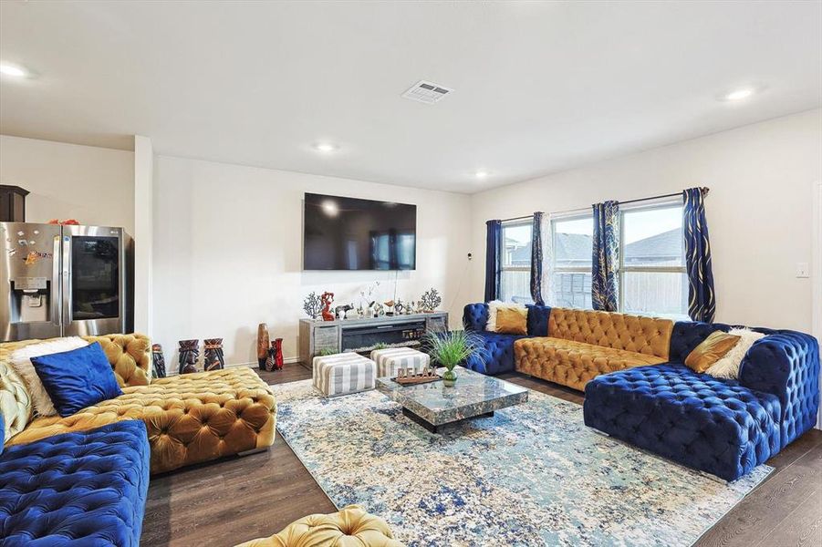 Living room with dark hardwood / wood-style floors