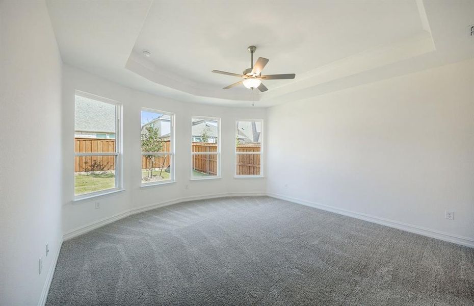 Elegant owner's suite with Bay window  *real home pictured